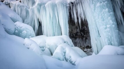Frozen waterfall cascades over icy rocks in a winter landscape with fresh snowfall creating a serene and cold natural scene. - Powered by Adobe