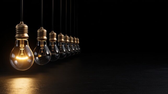 A series of light bulbs hanging from the ceiling, one of which is lit up