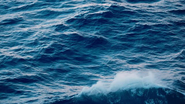Stunning and breathtaking images of tranquil ocean waves beautifully showcase rich, deep blue tones coupled with gentle white foam, making them ideal for relaxation as well as naturethemed purposes