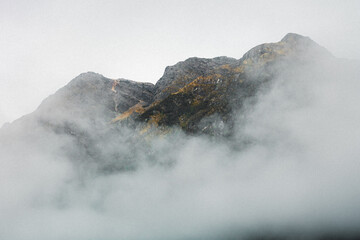 Mist covering mountains in the background