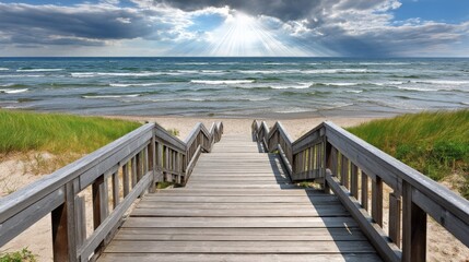 Obraz premium Wooden pathway leading to a sandy beach with ocean waves under a partly cloudy sky