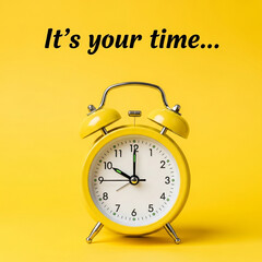 A yellow retro alarm clock on a yellow background, with the phrase "It's your time..." above it.
