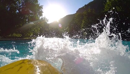 Slow Motion Splash of Water as Raft Hits the Pool in Backlit Scenic Illustration with Mountains