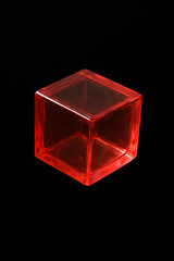 A translucent red glass cube against a black background.