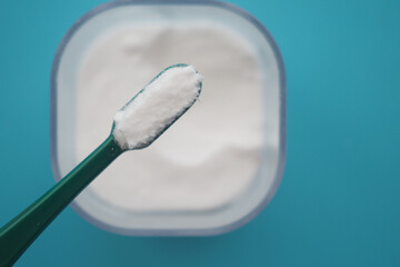 tooth brush and baking soda on a table 