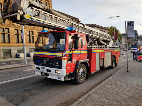 Greater Manchester Fire and Rescue Service emergency fire engine on a blue light run in Salford high ladder unit