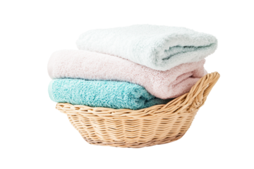 Stack of fluffy bath towels in a wicker basket, pastel colors, transparent background
