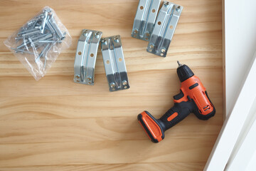 Working on a woodworking project with tools and materials
