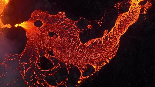 Incredible aerial of the dramatic volcanic eruption of the Litli Hrutur volcano eruption in Reykjanes peninsula Iceland. Flowing lava from the crater. Earthquakes.