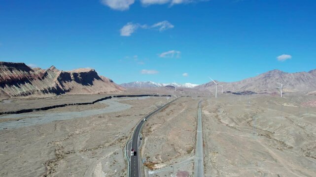 Drone view of Yadan landform near Kashgar in southern Xinjiang, China. High angle view of colorful mountains in sunny autumn day, 4k real time landscape footage b roll shot.