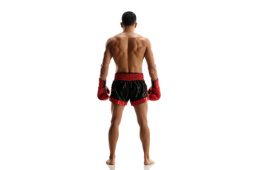 A muscular male muay thai boxer stands with his back to the camera, isolated on white background