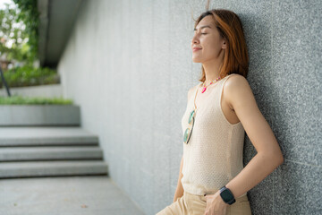 Fototapeta premium Casual smart business woman relax outdoor city office building