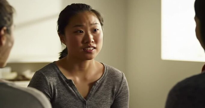 Woman Sharing Concerns During a Group Therapy Session