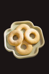 Close-up of Delicious Round Desserts on a Light Green Plate