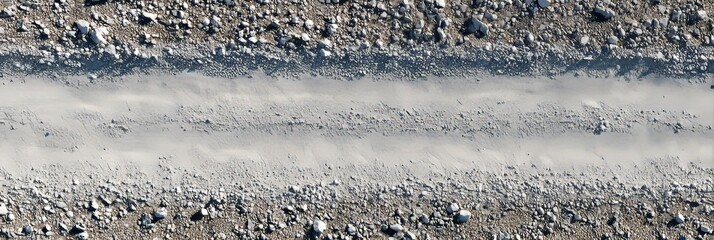 Aerial view of a white gravel road under bright sunlight with no other elements present.  