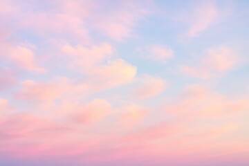 Obraz premium Dreamy pastel sky background with soft cloud formations
