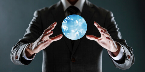 businessman holding a sphere with a globe in his hands.