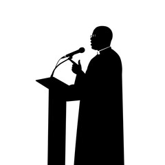 Silhouette of a speaker at a podium with microphone