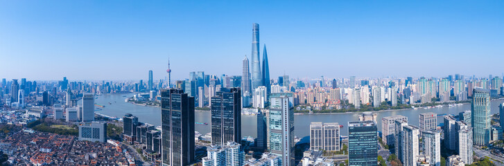 Fototapeta premium Aerial view of Shanghai modern buildings and traditional residential buildings on sunny day.