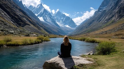 Fototapeta premium Nature escape through therapy with serenity and peace concept. A serene woman reflects by a tranquil mountain river landscape.