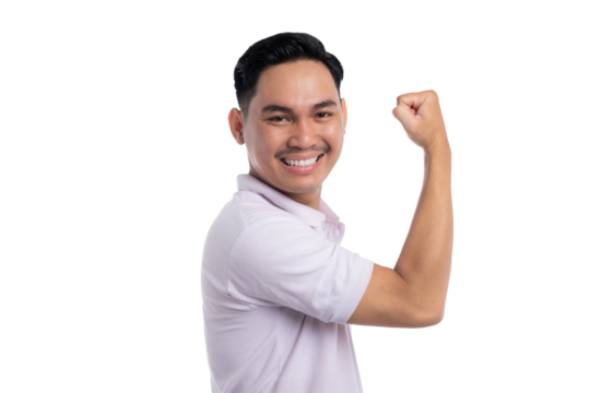 Confident young man showing bicep and smiling with proud expression isolated on transparent background