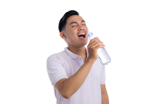 Happy young man drinking from a plastic bottle of mineral water isolated on transparent background