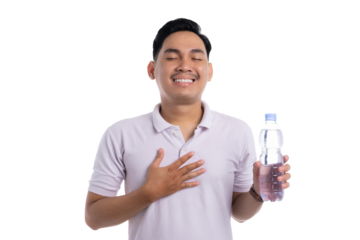 Smiling young man feeling grateful while holding a bottle of mineral water isolated on transparent background