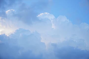 White Clouds Against Bright Blue Sky in Serene Daylight Atmosphere