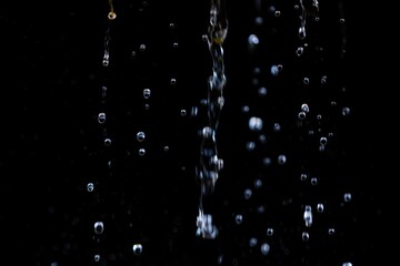 Water Droplets Falling on a Dark Background with Amazing Clarity