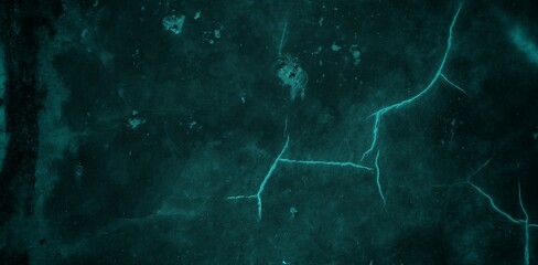 A textured background featuring a deep teal color with a distressed, grunge appearance. The surface shows variations in tone and subtle patterns, creating an abstract and moody aesthetic.