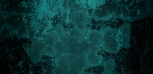 A textured background featuring a deep teal color with a distressed, grunge appearance. The surface shows variations in tone and subtle patterns, creating an abstract and moody aesthetic.
