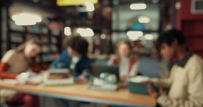 Group, blur and college with friends in library for education, future and student life. Assignment resources, knowledge and study habits with people on campus for school scholarship and thesis