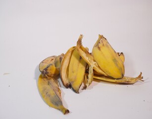 Stack of used banana peels isolated on a white background. High-quality image ideal for composting,...