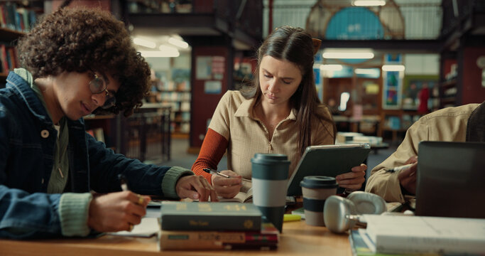 Group, research and college with woman in library for education, future and student life. Assignment resources, knowledge and study habits with people on campus for school scholarship and thesis