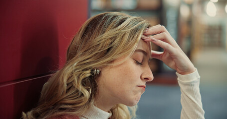 Fototapeta premium College, woman or student with stress in library, campus or overwhelmed with assessment deadline. University, headache or female person with anxiety for exam challenge, test fail or worry for results