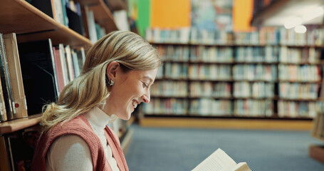 Library, student and reading book with happiness for education, research and knowledge in college. University, laughing and woman with studying for thesis, english literature and learning for exam