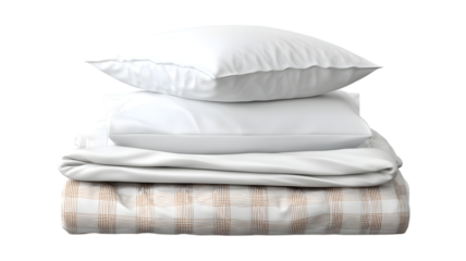Stack of freshly laundered bed linens including pillows and a plaid comforter isolated against black