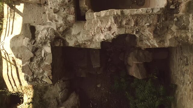 Aerial top down preserved remains facilities rooms of the ancient royal bath structure at Armaziskhevi site, surrounded by greenery under protective roof in Mtskheta region, Georgia
