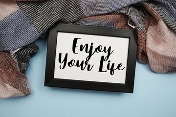 Enjoy Your Life Motivational and Inspirational quotes on light blue background