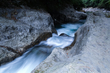 Serene Mountain Stream Flowing Over Rocks