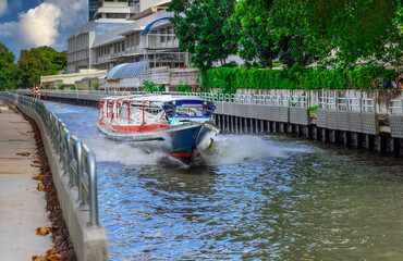 Ferry boat going through a Canal Khlong in Thai running from Soi 15 Sukhumvit Rd NANA to Soi 21...