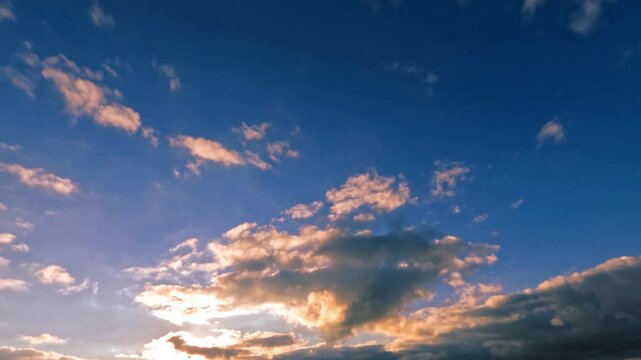 timelapse of the sky of fluffy clouds at sunset after the rain for forecast
