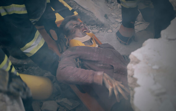 Teenager being saved from debris