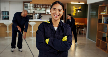 Girl, portrait and janitor with smile for maintenance job, hygiene and arms crossed with team in...