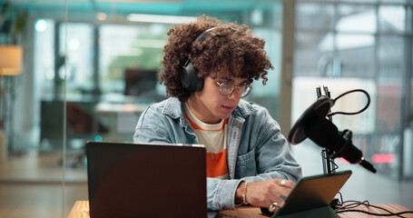 Man, tablet and headphones with mic for broadcast, recording podcast and live streaming. Male...