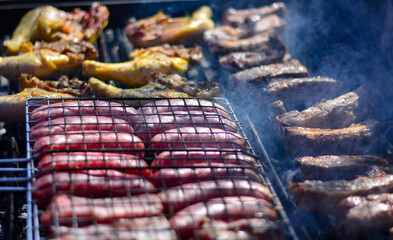 the meat on the barbecue almost ready for the joy of adults and children