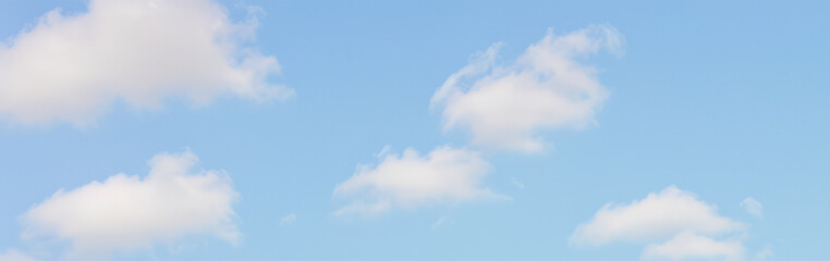 Blue sky with white clouds on a sunny day background.