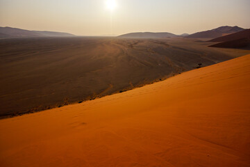 View from Dune 45 onto the plains of Sossusvlei at sunrise, Namib-Naukluft, Namibia
