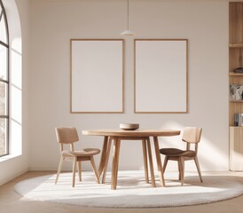 Minimalist dining area with two wooden chairs, round wooden table, two blank framed prints, arched window, and off-white walls, all bathed in sunlight