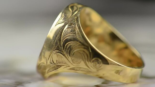 Ornate gold signet ring closeup